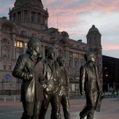 Poster image of the bronze statue of the beatles outside the liver buildings in liverpool