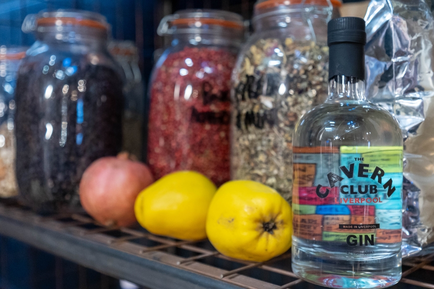 The Cavern Club Gin bottle on shelf with gin ingredients