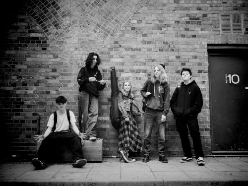 MoKat performing live at The Cavern Club – energetic five-piece indie rock band blending Bowie-inspired sounds with modern influences.