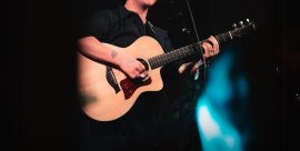 Kyle Falconer performing live on stage with acoustic guitar at The Cavern Club Liverpool, 10 September 2025