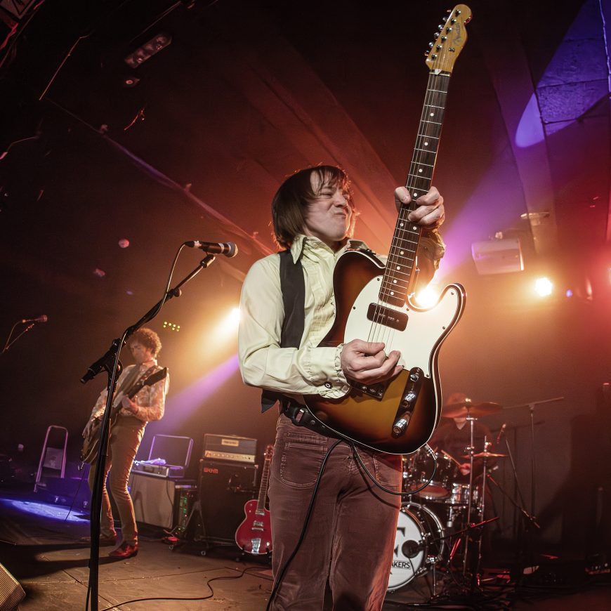 Small Fakers Small Faces tribute band performing live at The Cavern Club Liverpool with electric guitar