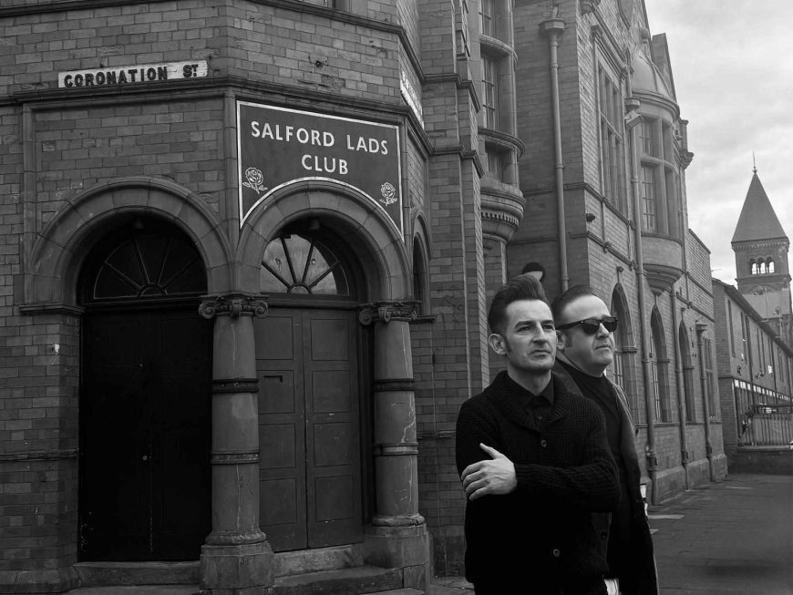 These Smiths tribute band outside Salford Lads Club in Manchester recreating iconic The Smiths imagery